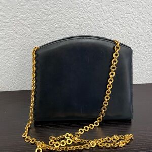 Elegant Black Leather Salvatore Ferragamo Bag with Gold Chain